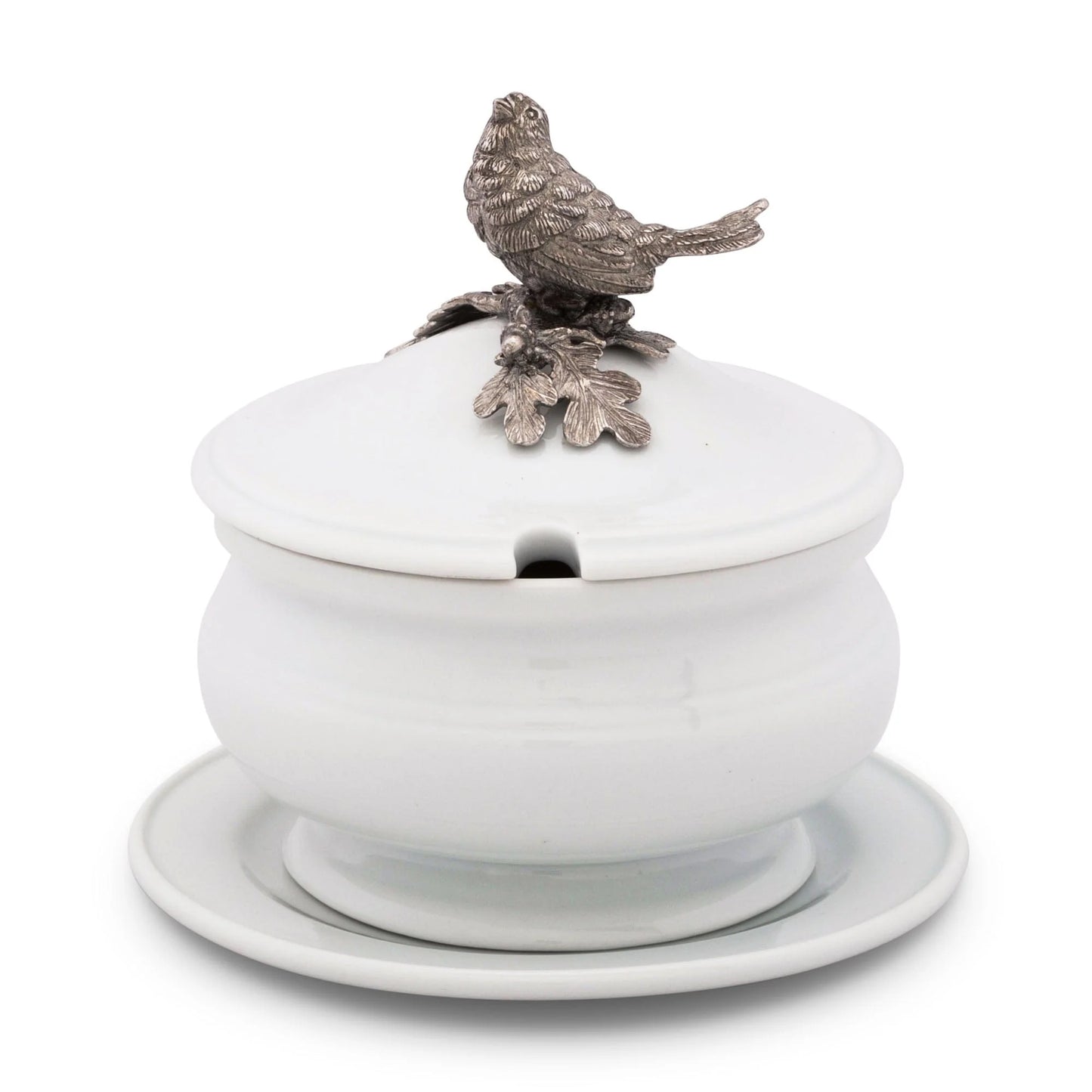 Salsera en porcelana con tapa y un pajaro decorativo.